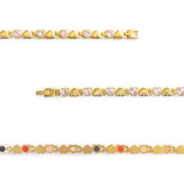 Close-up of Dream bracelet showing gold-plated settings with pink crystal heart links.